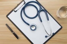 stock-photo-78463797-stethoscope-in-doctors-desk.jpg